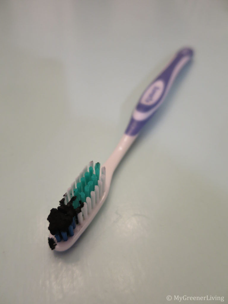 Toothbrush with charcoal. using charcoal to whiten teeth.